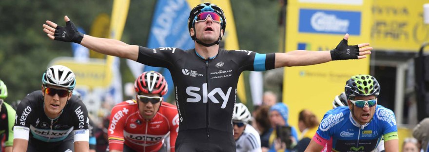 Winner crossing line at Tour of Britain cycling race