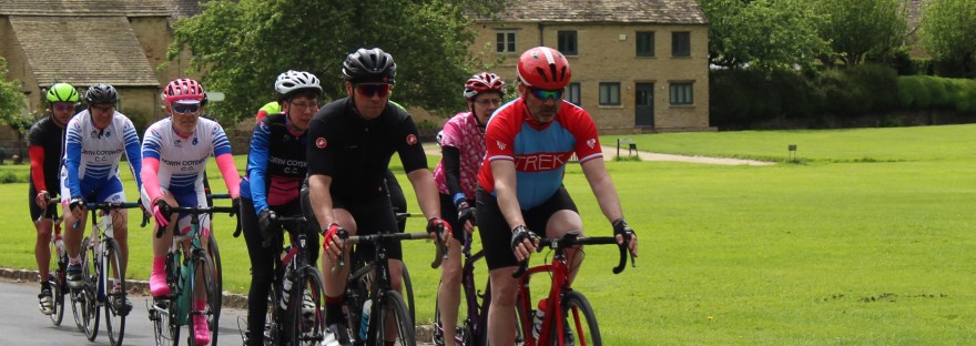 Cyclists cycling through The Cotswolds